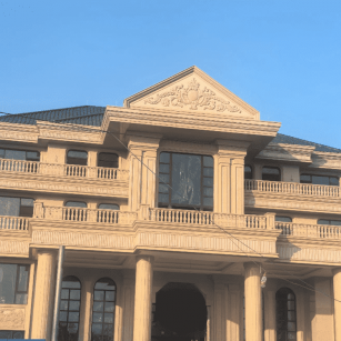 山东黄金麻别墅外墙干挂石材效果示例